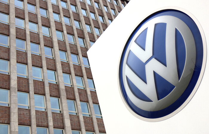 FILE - In this Friday, April 13, 2018 file photo, Volkswagen logo is pictured in front of a company building in Wolfsburg, Germany. German carmaker Volkswagen reports second-quarter earning FILE - In this Friday, April 13, 2018 file photo, Volkswagen logo is pictured in front of a company building in Wolfsburg, Germany. German carmaker Volkswagen reports second-quarter earning