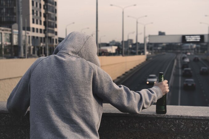 / Person in Gray Hoodie Holding Beer - Pexels.com /