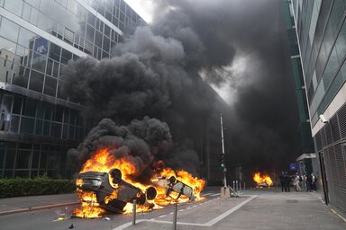 FILE - Cars burn after a march for Nahel, Thursday, June 29, 2023 in Nanterre, outside Paris. The killing of 17-year-old Nahel during a traffic check Tuesday, captured on video, shocked the