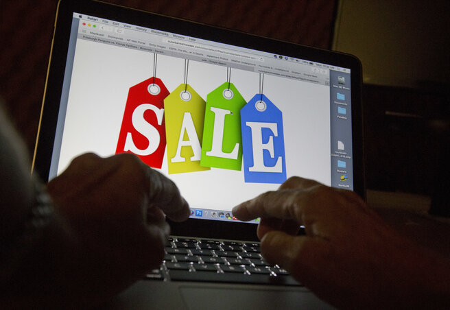 In this Dec. 12, 2016, photo, a person searches the internet for sales, in Miami. Days after flocking to stores on Black Friday, consumers are turning online for Cyber Monday to score more d