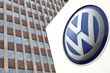 FILE - In this Friday, April 13, 2018 file photo,  Volkswagen logo is pictured in front of a company building in Wolfsburg, Germany. German carmaker Volkswagen reports second-quarter earning
