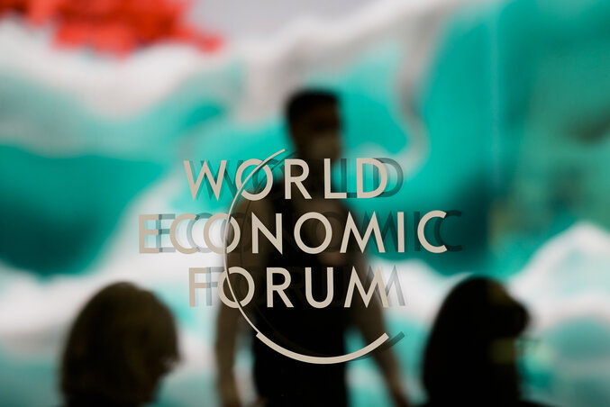 The logo of the World Economic Forum displayed on a window during the Annual Meeting of the Forum in Davos, Switzerland Tuesday, Jan. 17, 2023. The annual meeting of the World Economic Forum