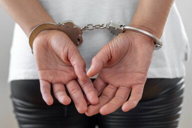 Criminal wearing handcuffs