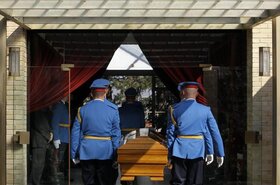 A military honor guard carries the casket bearing Jovanka Broz, the late widow of former Yugoslav communist leader Josip Broz Tito, during the funeral in Belgrade, Serbia, Saturday, Oct. 26, 2013. Former Yugoslavia's first lady Jovanka Broz was laid to re